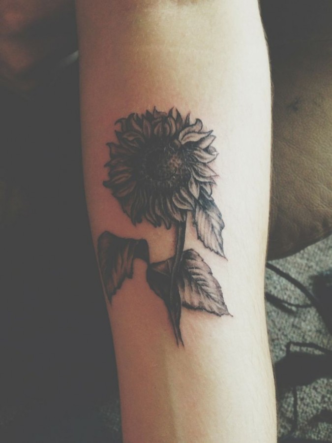 Simple black sunflower tattoo