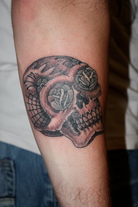 Skull and rose tattoo by Mike Schweigert