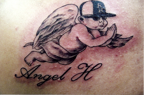 Small baby angel tattoo