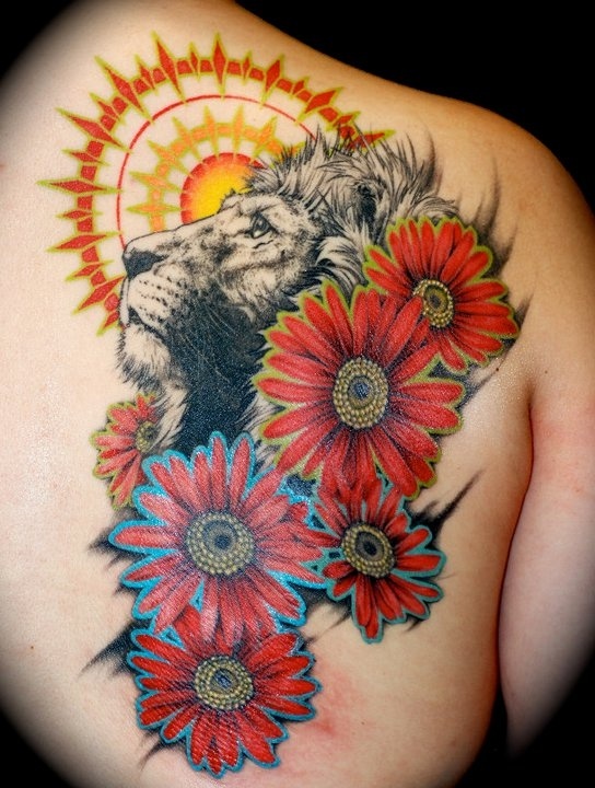 Sun and flowers lion tattoo