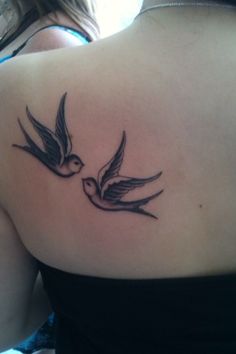 Two swallows on the back