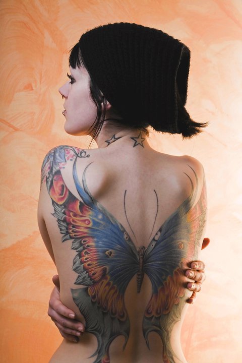 Woman back butterfly tattoo