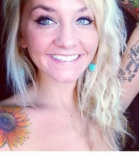 Woman sunflower tattoo