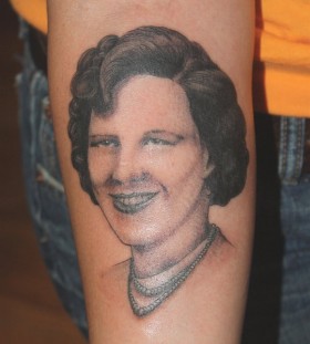 Woman tattoo by Mike Schweigert