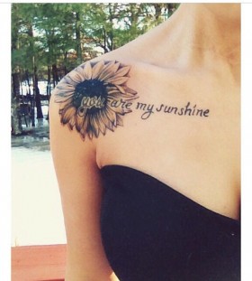 Words and sunflower tattoo