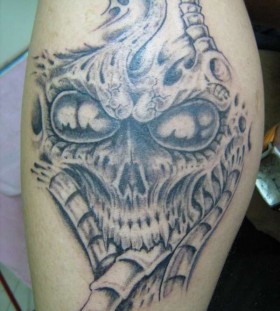 big alien tatto on arm