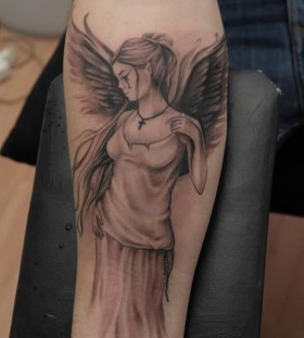 crying angel on arm