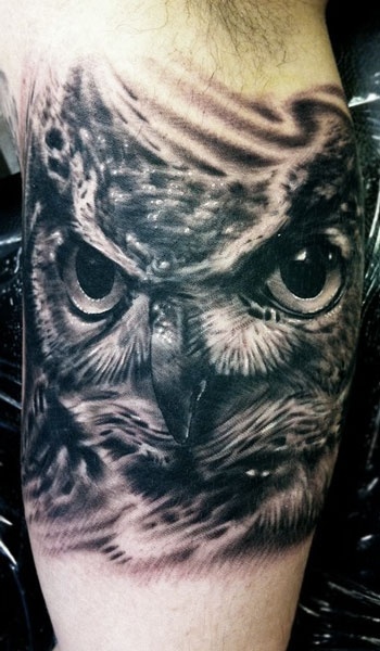 Adorable black owl tattoo