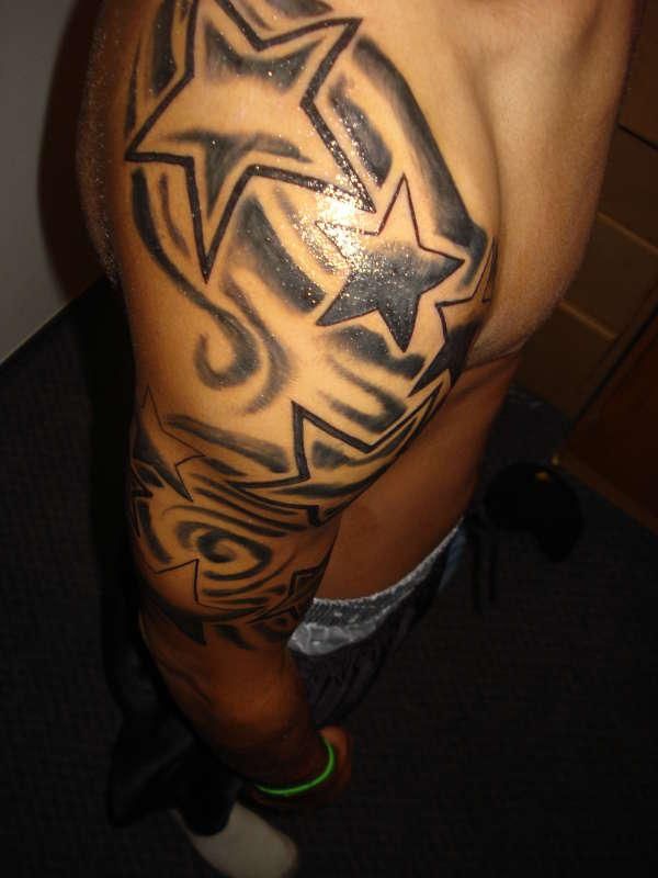 Amazing blue and black star tattoo