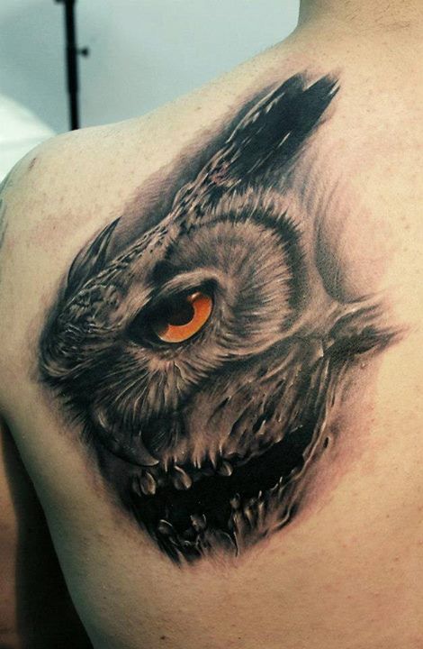 Amazing red owl tattoo