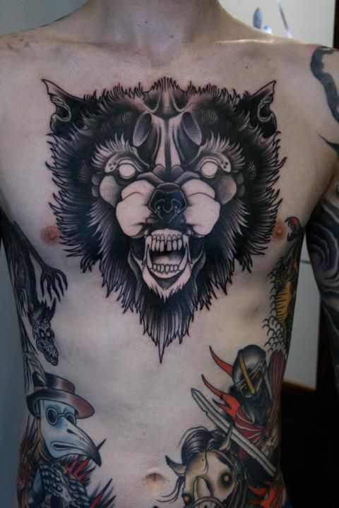 Angry animal tattoo on chest