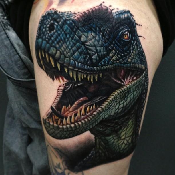 Angry dinosaur tattoo