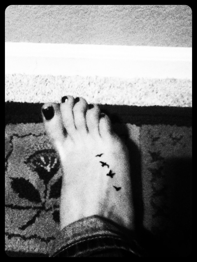 Bird foot tattoo