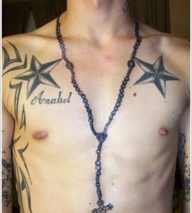 Black chest star tattoo