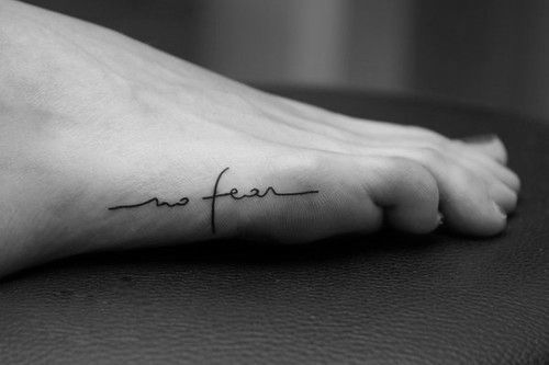 Black letters foot tattoo