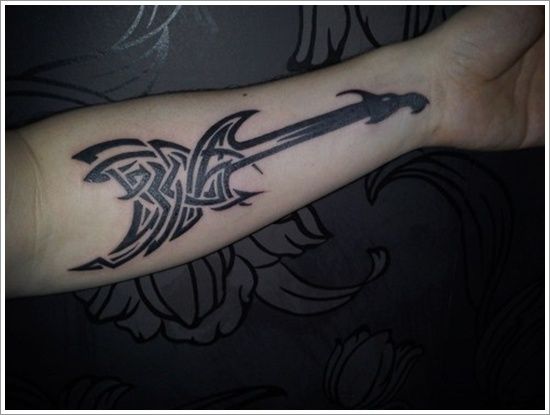 Black symetric guitar tattoo