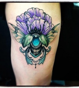 Blue and purple insect tattoo