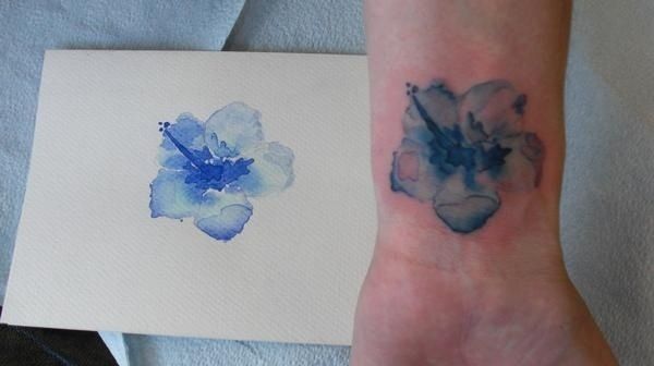 Blue flower painting tattoo