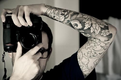 Camera and dragon tattoo