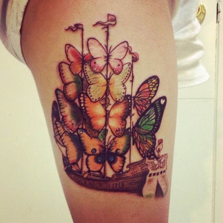 Colorful butterflies and ship tattoo