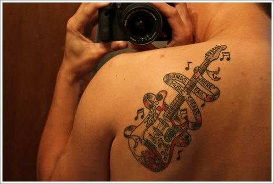 Colorful shoulder guitar tattoo