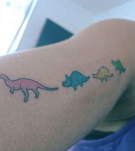 Colorful small dinosaur tattoo