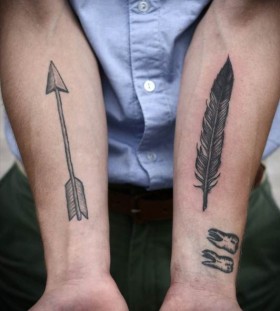 Feather and arrow tattoo