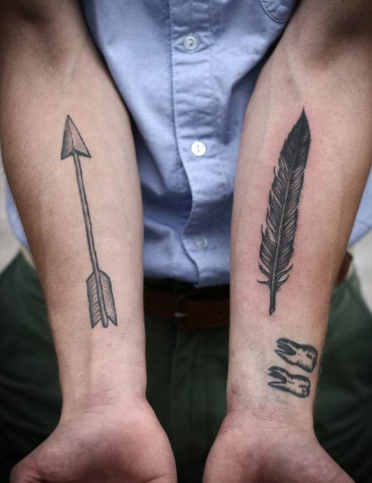 Feather and arrow tattoo