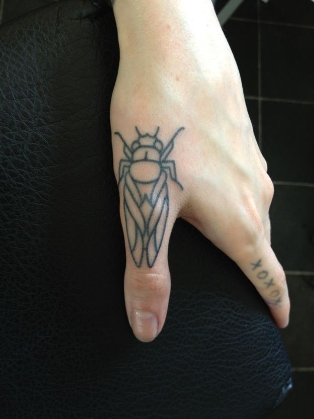 Finger insect tattoo