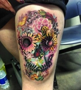 Flowers and butterfly skull tattoo