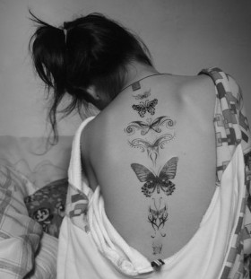 Girl back butterfly tattoo