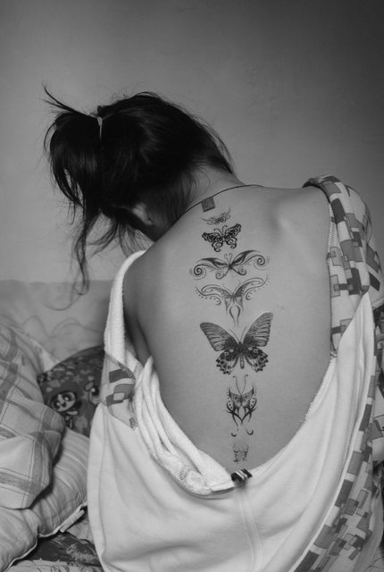 Girl back butterfly tattoo