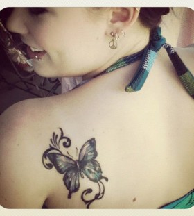 Girl shoulder butterfly tattoo