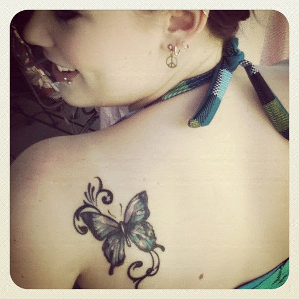 Girl shoulder butterfly tattoo