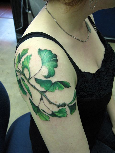 Green leaf tattoo