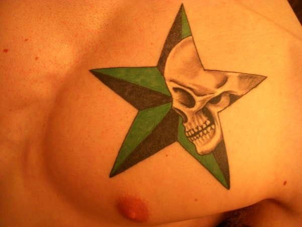 Green skull star tattoo