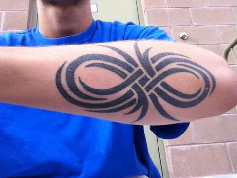 Men’s black infinity tattoo