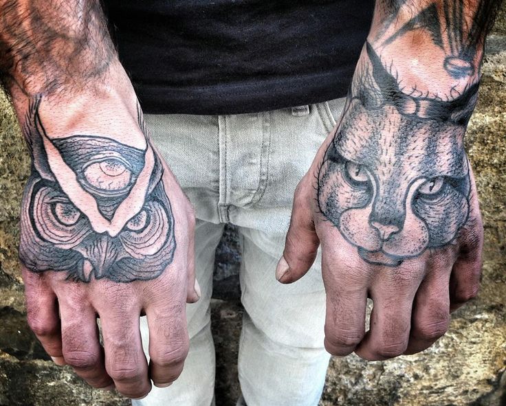 Men’s hand cat and owl tattoo