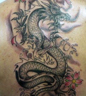 Pink flowers and dragon tattoo