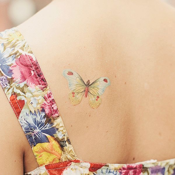 Pretty back butterfly tattoo