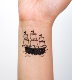 Pretty small ship tattoo