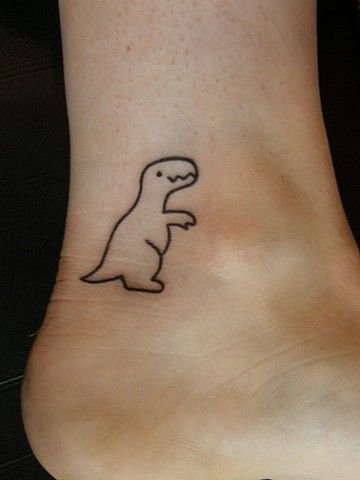 Pretty smiling dinosaur tattoo