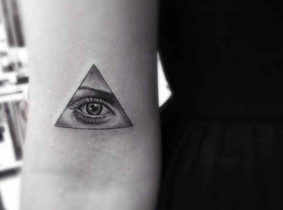 Realistic woman eye tattoo