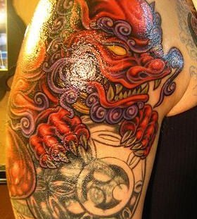 Red and black dragon tattoo