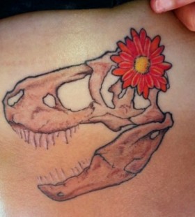 Red flower and dinosaur tattoo