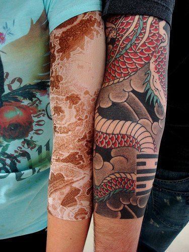 Red snake lace tattoo