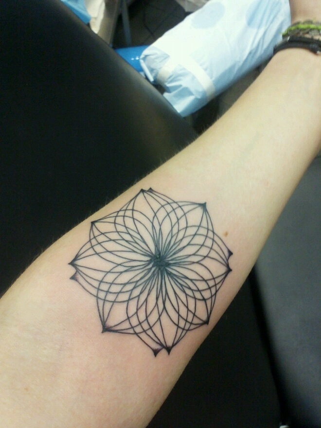 Simple hand lotus flower tattoo