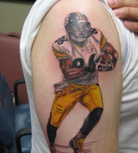 Simple shoulder football tattoo