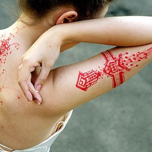 Simple woman red tattoo