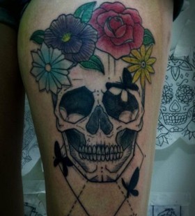 Skull and colorful flowers tattoo by Tyago Compiani